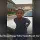 A 10-year-old identified as Michael Thomas Jr. is cuffed by police as an outraged community looks on.